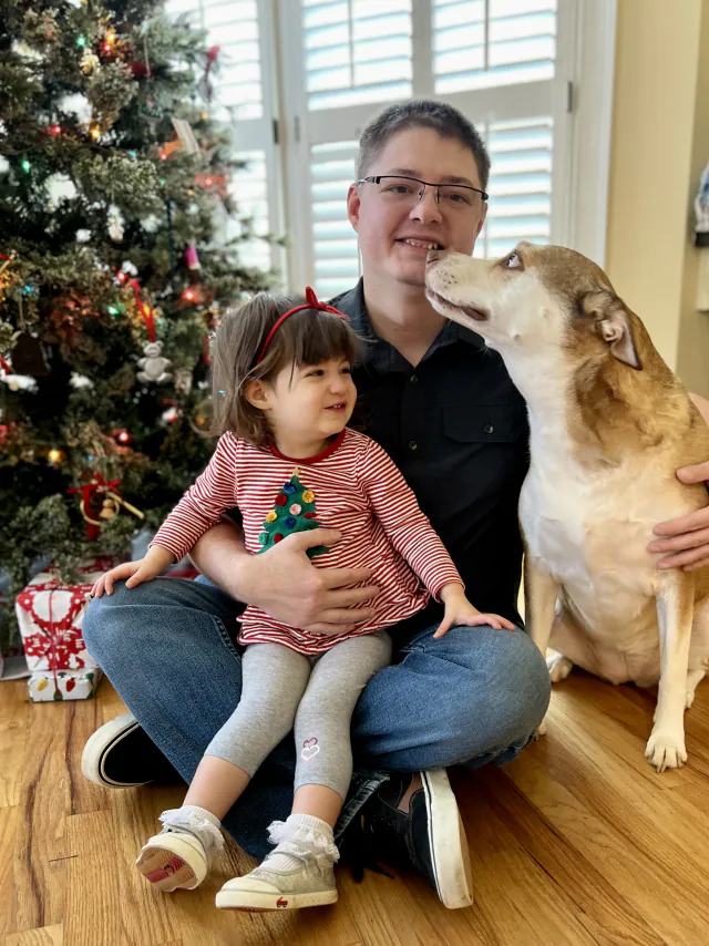 Phil with daughter and dog Rhea enjoying family time